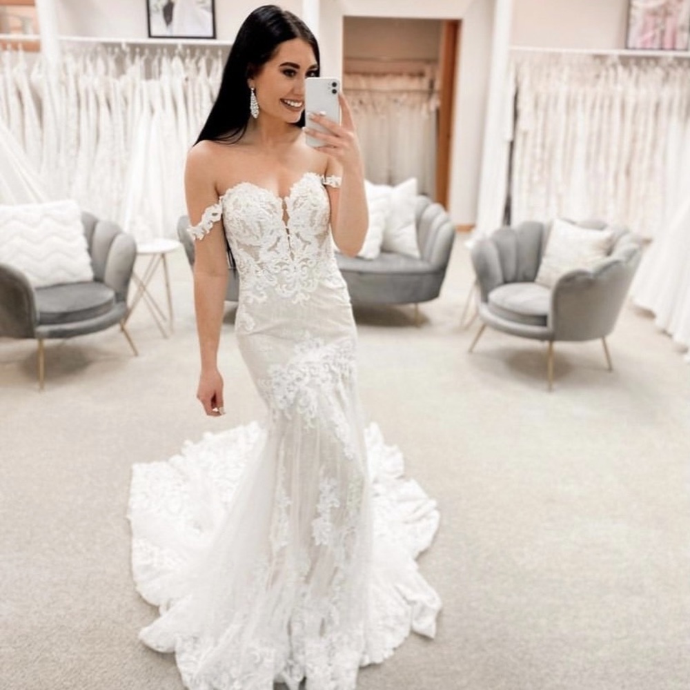 Gorgeous dress! Brand new, never worn. No alterations or hems done on dress.